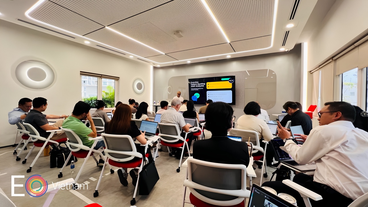 EO Vietnam members working through the Session One leadership workshop on laptops